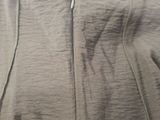 the back of a gray hoodie with a zipper down the side
