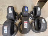four tires stacked on top of each other on a floor