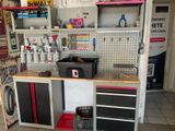 a workbench in a garage with a lot of tools on it