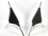 pair of black and silver chairs on a white background