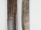 two knives that are next to each other on a wall