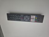 a remote control sitting on a white surface