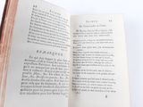 an open book on a table with a white background