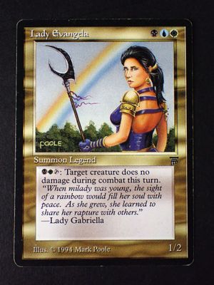 a close up of a card with a picture of a woman holding a scythe