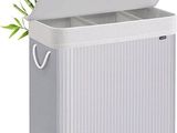 a close up of a white trash can with a plant in it