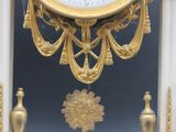 a clock that is hanging on the wall in the room