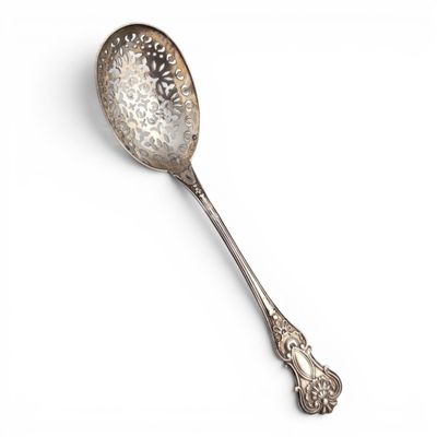 a close up of a spoon on a white surface