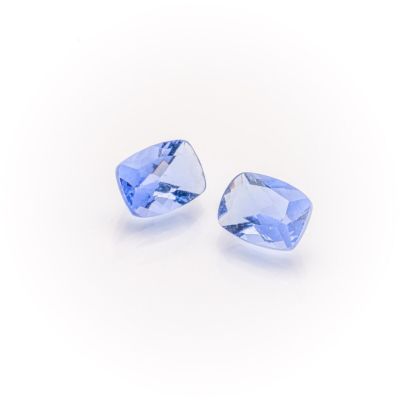 a pair of blue sapphires on a white background