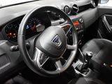 a steering wheel and dashboard of a small car