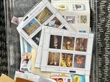 a bag of postcards on the floor next to a pair of shoes