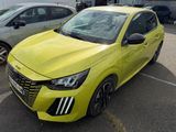 the bright yellow car is parked in the parking lot next to other cars