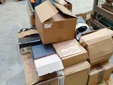 a pile of boxes on a pallet in a warehouse