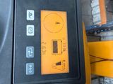 a control panel on the side of a yellow machine