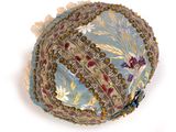 a blue hat with a floral design on it