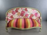a couch with a colorful floral pattern on it