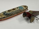 a small toy airplane next to a small toy boat