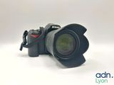 a close up of a camera with a lens attached to it