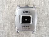 a close up of a silver cell phone on a cloth