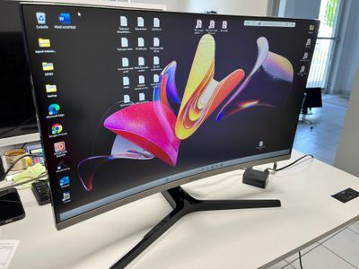 a close up of a computer monitor sitting on top of a desk