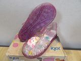 a box that has a pair of shoes on top of it