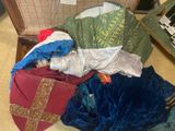 a suitcase full of clothes sitting on the floor