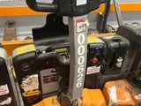 a forklift that is sitting on a table in a warehouse