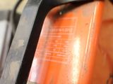 an orange fire extinguisor sitting on a table