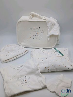 white baby gift set with hat, mittens, diaper, and blanket