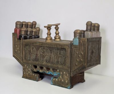 a metal box that has a bunch of bottles on top of it