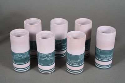six cups that are sitting next to each other