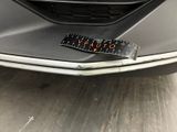 a sticker on the front of a car that says caution