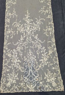 a close up of a table runner on a black table