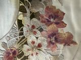 a white plate with flowers on it on a table