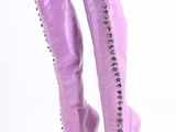 purple high heel boots with studs on the side of them