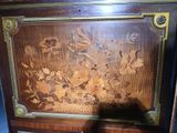 a wooden cabinet with a floral design on it
