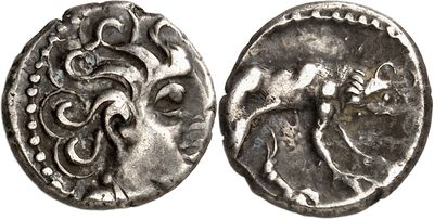 a close up of a silver coin with a horse on it
