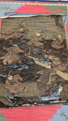 an image of a piece of cloth that has been torn off