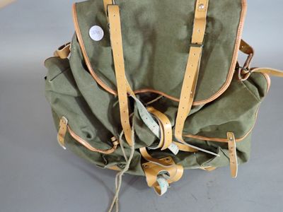 a backpack with headphones attached to it sitting on a table