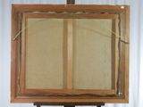 an image of a painting on a easel with a piece of paper taped to it