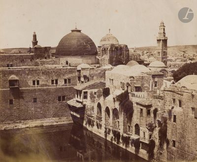an old photo of a view of a city from the top of a hill