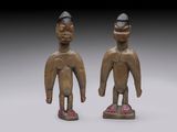 pair of wooden figures of a man and a woman