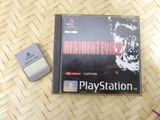 resident evil 2 playstation game box with a mouse and a mouse pad