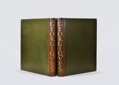 a green book with gold lettering on the cover