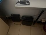 a picture of a small room with a computer and a printer