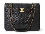 a chanel black quilted leather tote bag with gold hardware