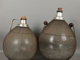 pair of antique pewed metal jugs with handles and handles