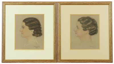 two framed portraits of a woman in profile and a man in profile