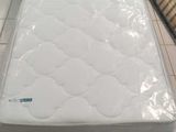 a mattress that is sitting on the floor in the room