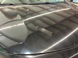 a close up of a car ' s hood with a sticker on it