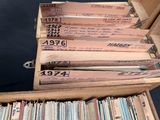 a lot of old records in a wooden box